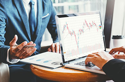 Father walks with his children Father carries two young children whilst third runs into distance emphasising importance of making a will